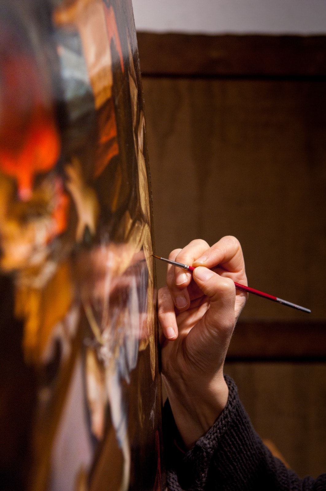 Réintégration chromatique au pinceau fin sur une peinture